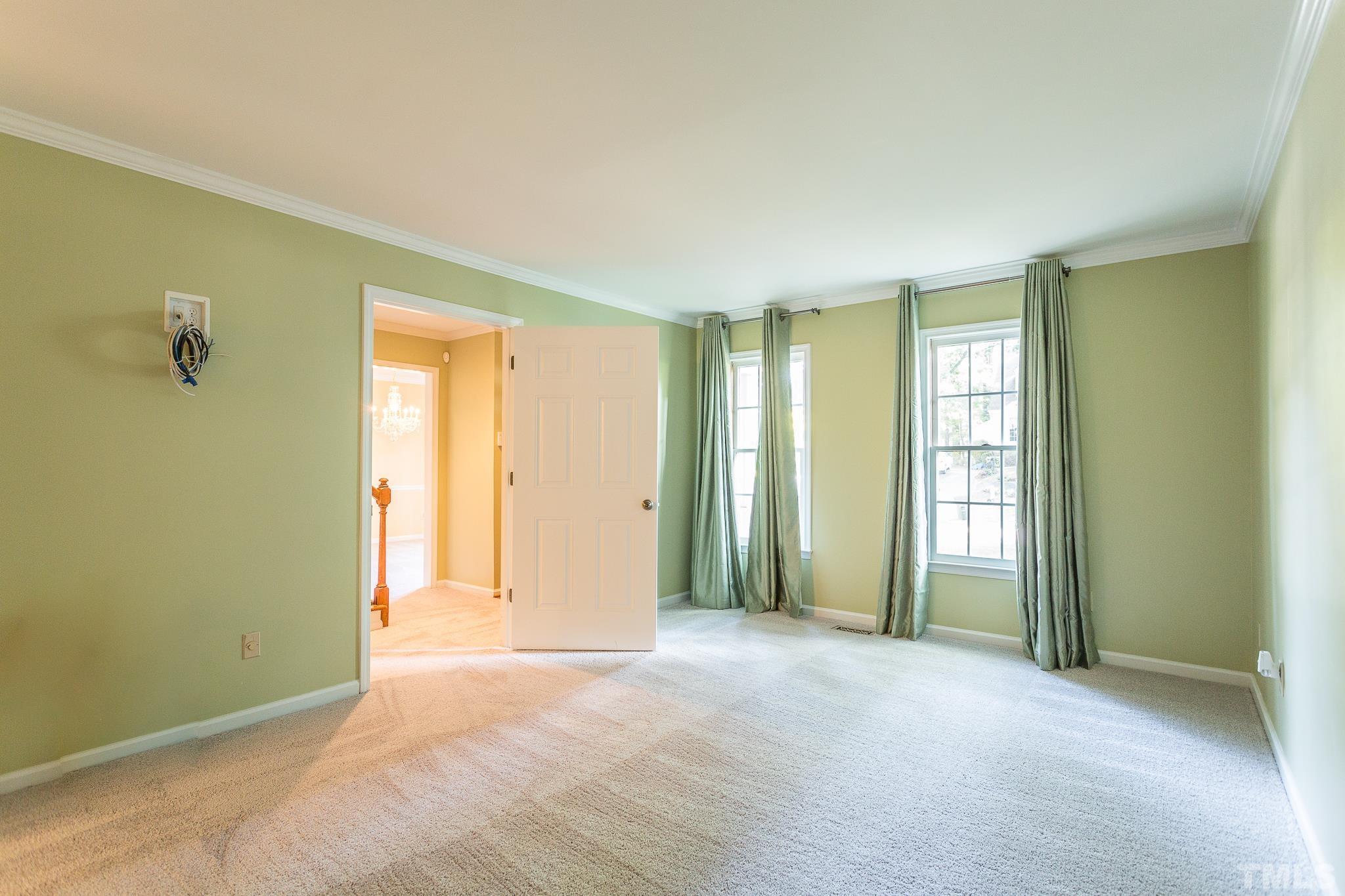 1200 Oakside Court Raleigh, NC 27609 - Photo 13 of 28 an empty room with windows and closet
