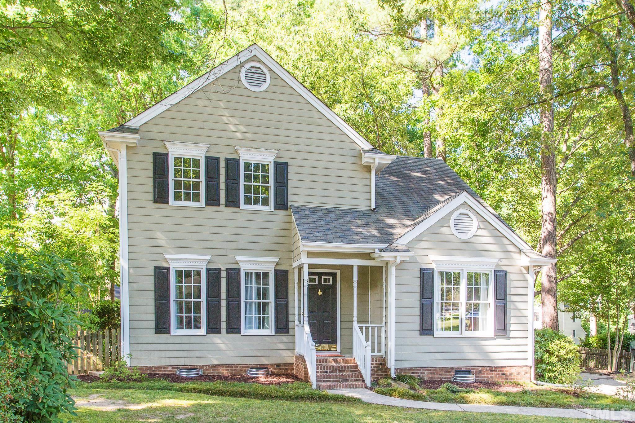 1200 Oakside Court Raleigh, NC 27609 - Photo 2 of 28 a front view of a house with a yard