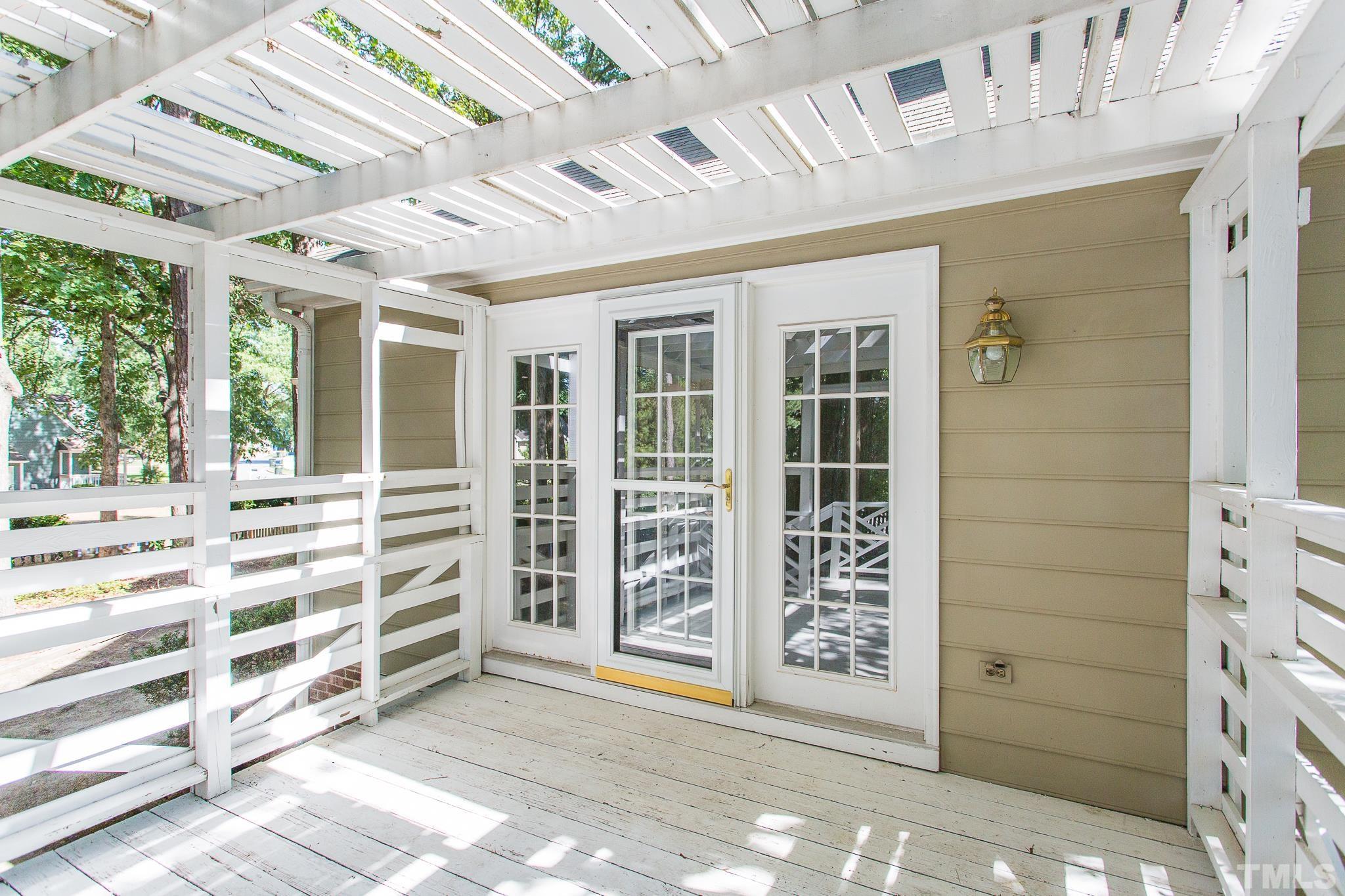 1200 Oakside Court Raleigh, NC 27609 - Photo 25 of 28 a view of front door with wooden walls