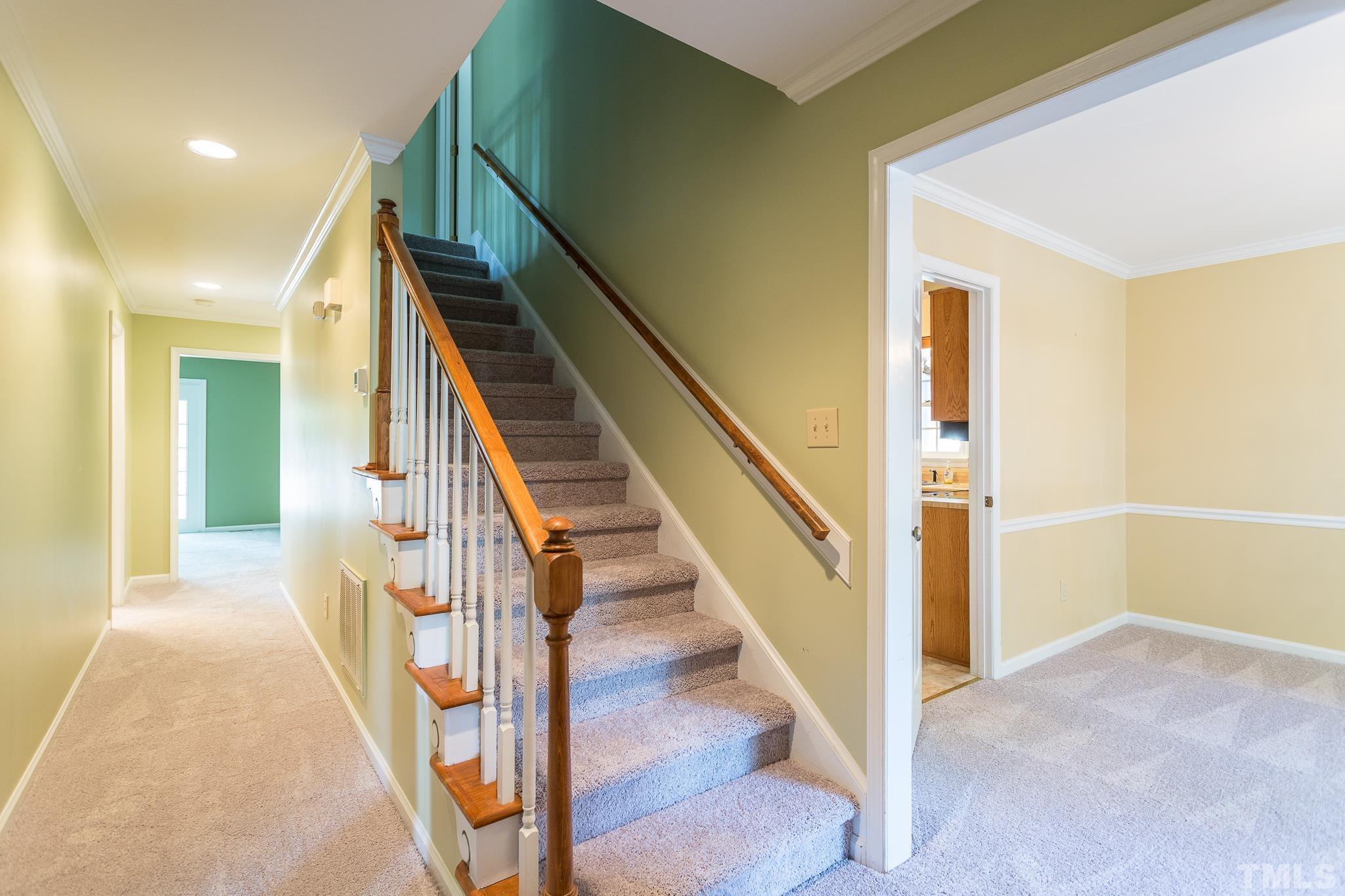 1200 Oakside Court Raleigh, NC 27609 - Photo 3 of 28 a view of entryway and hall with wooden floor