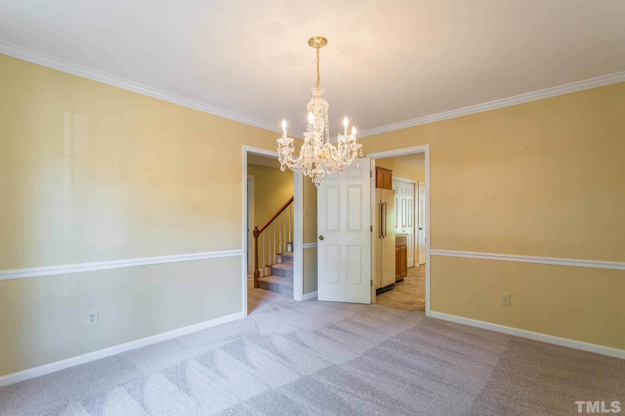 1200 Oakside Court Raleigh, NC 27609 - Photo 5 of 28 a view of a livingroom with a chandelier