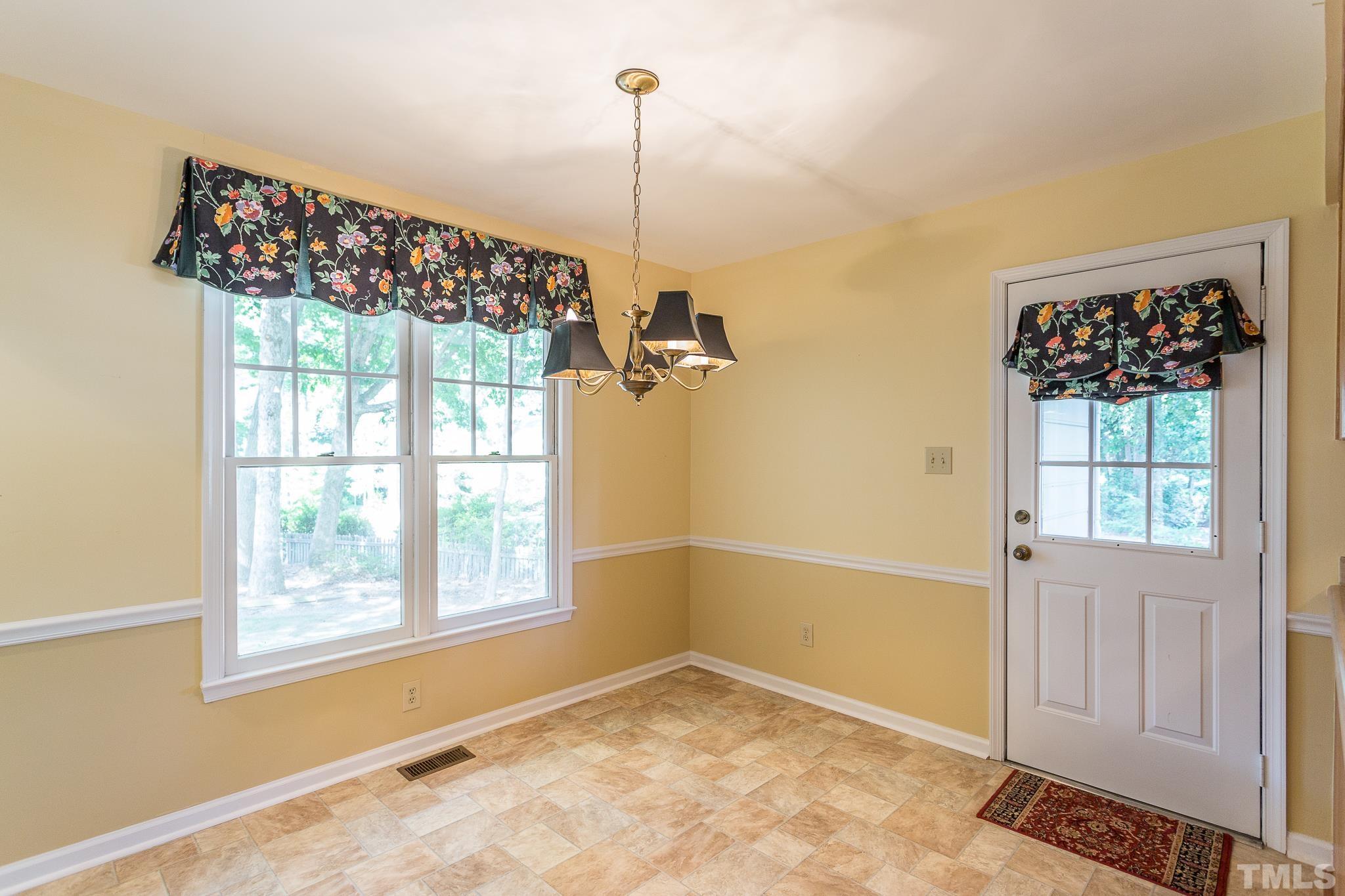 1200 Oakside Court Raleigh, NC 27609 - Photo 8 of 28 a view of an empty room with a window