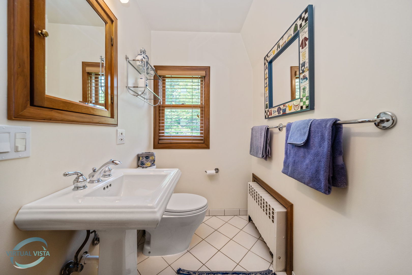380 Fairbank Road Riverside, IL 60546 - Photo 19 of 30 a bathroom with a toilet a sink and mirror