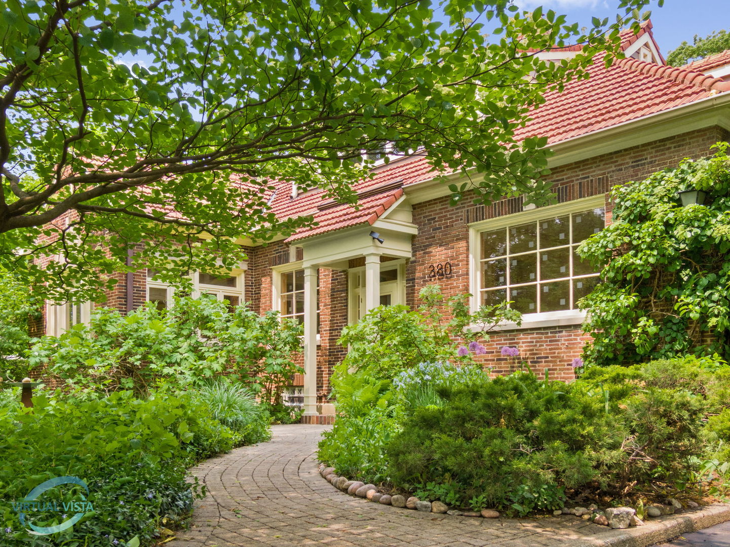 380 Fairbank Road Riverside, IL 60546 - Photo 2 of 30 a front view of a house with garden