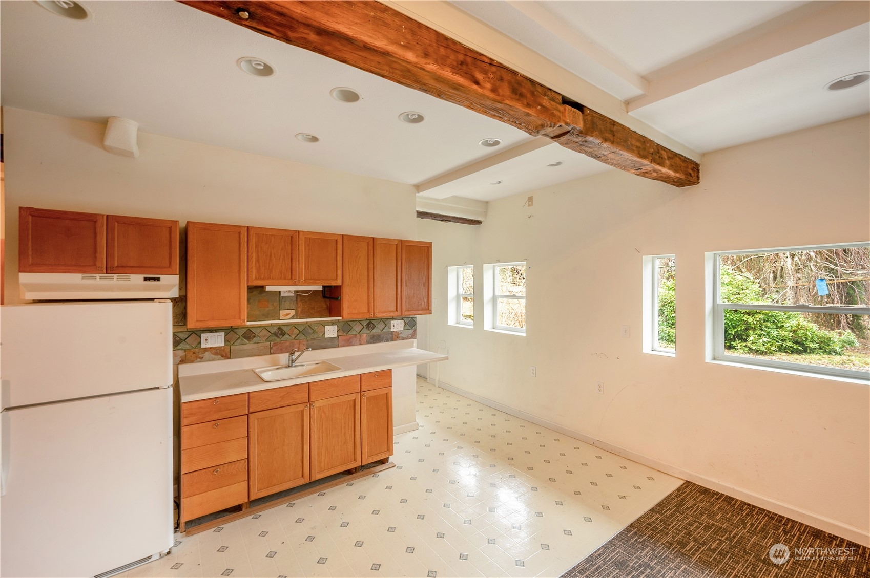 1848 Kelly Road Bellingham, WA 98226 - Photo 19 of 39 a kitchen with a sink a refrigerator and window