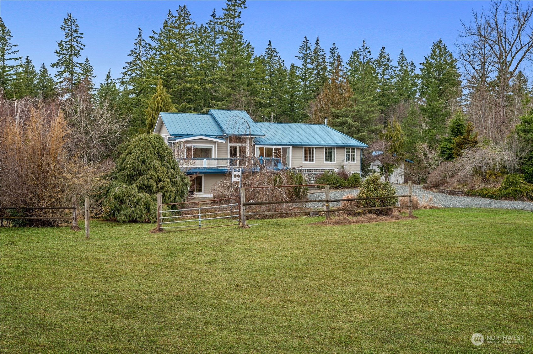 1848 Kelly Road Bellingham, WA 98226 - Photo 32 of 39 a front view of a house with a garden and trees
