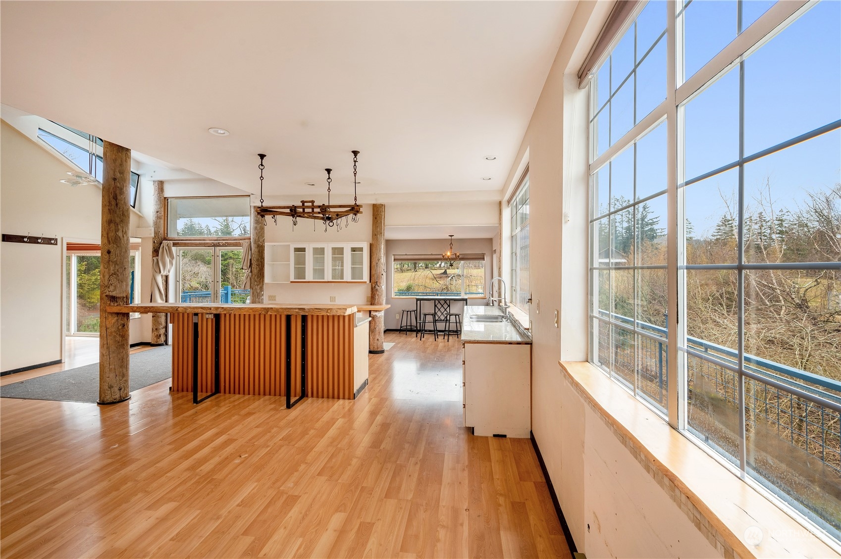 1848 Kelly Road Bellingham, WA 98226 - Photo 9 of 39 a view of a living room with furniture wooden floor and windows