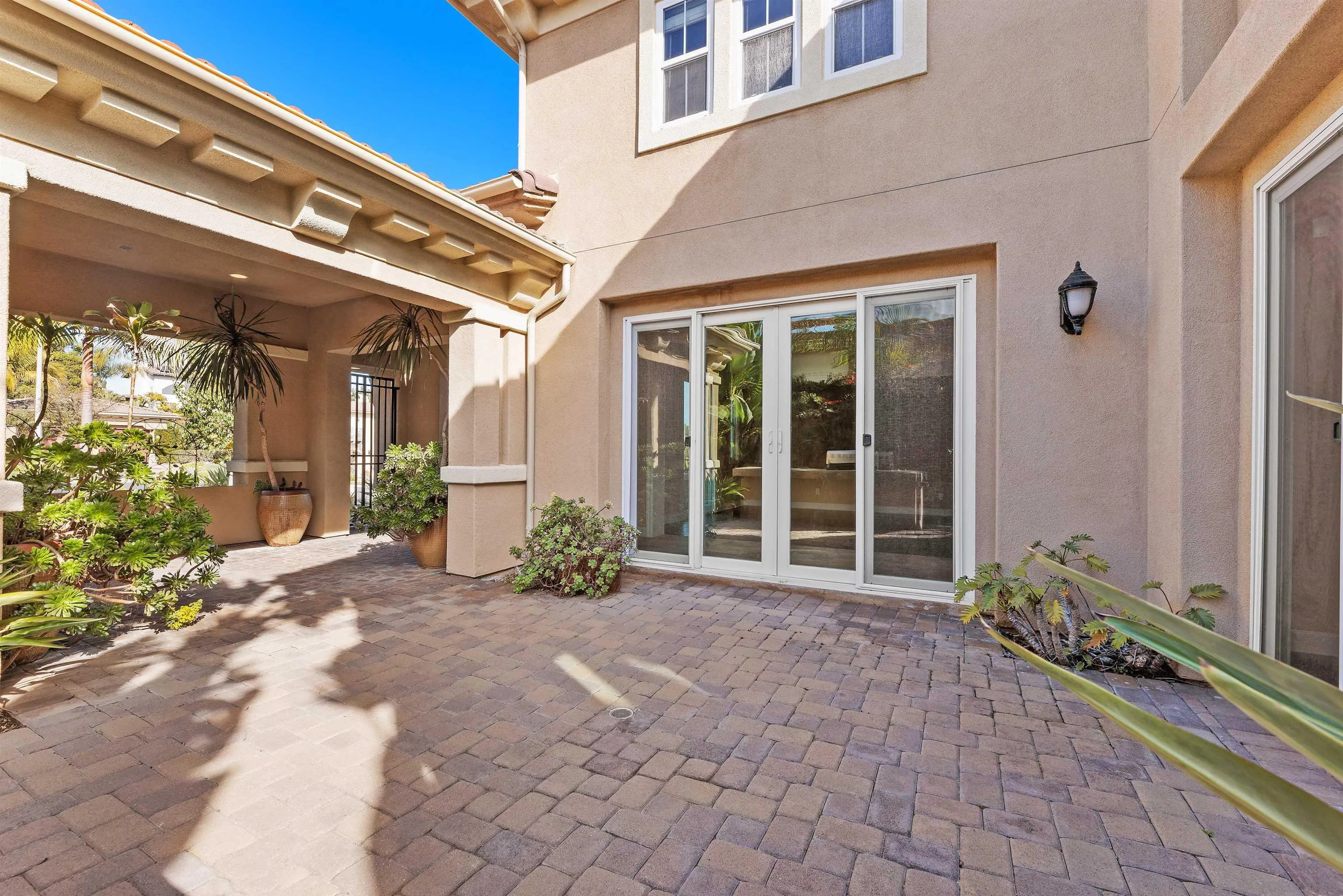 527 Quail Pointe Lane Encinitas, CA 92024 - Photo 11 of 46 a view of a building with potted plants