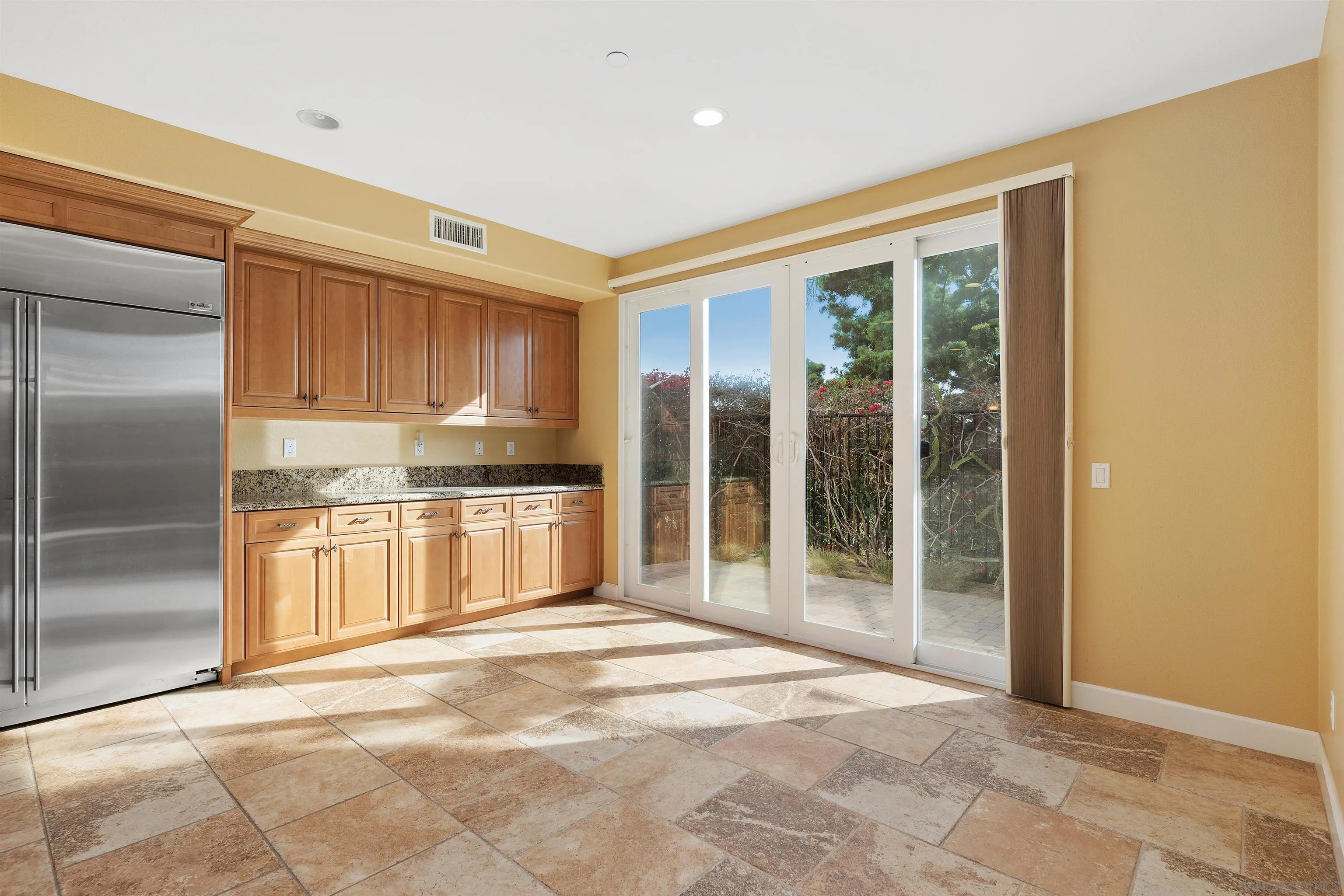 527 Quail Pointe Lane Encinitas, CA 92024 - Photo 21 of 46 a large kitchen with a stove a refrigerator and a sink