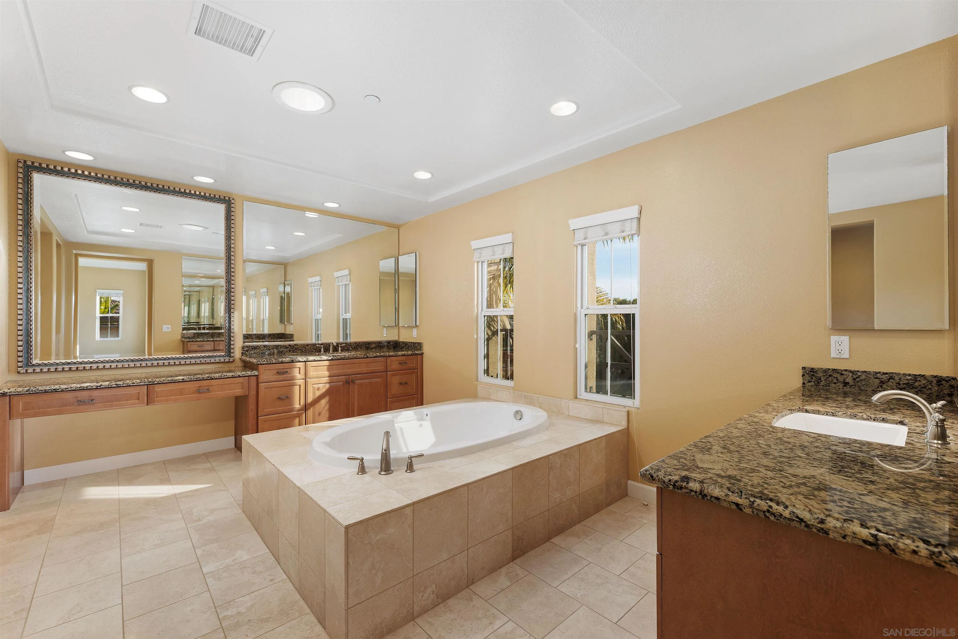 527 Quail Pointe Lane Encinitas, CA 92024 - Photo 27 of 46 a large white kitchen with a large window