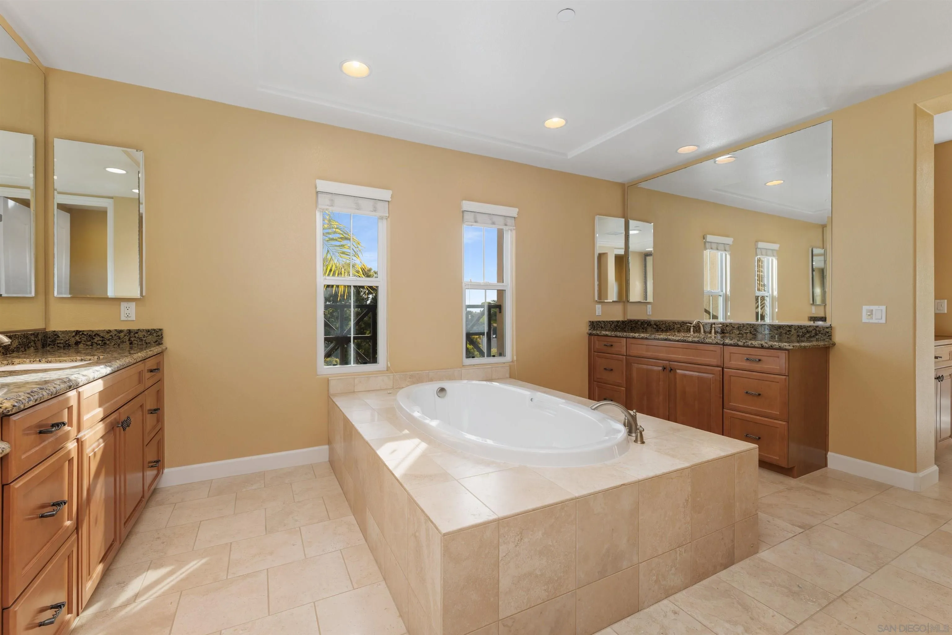 527 Quail Pointe Lane Encinitas, CA 92024 - Photo 29 of 46 a large kitchen with a sink and dishwasher a stove top oven with wooden floor