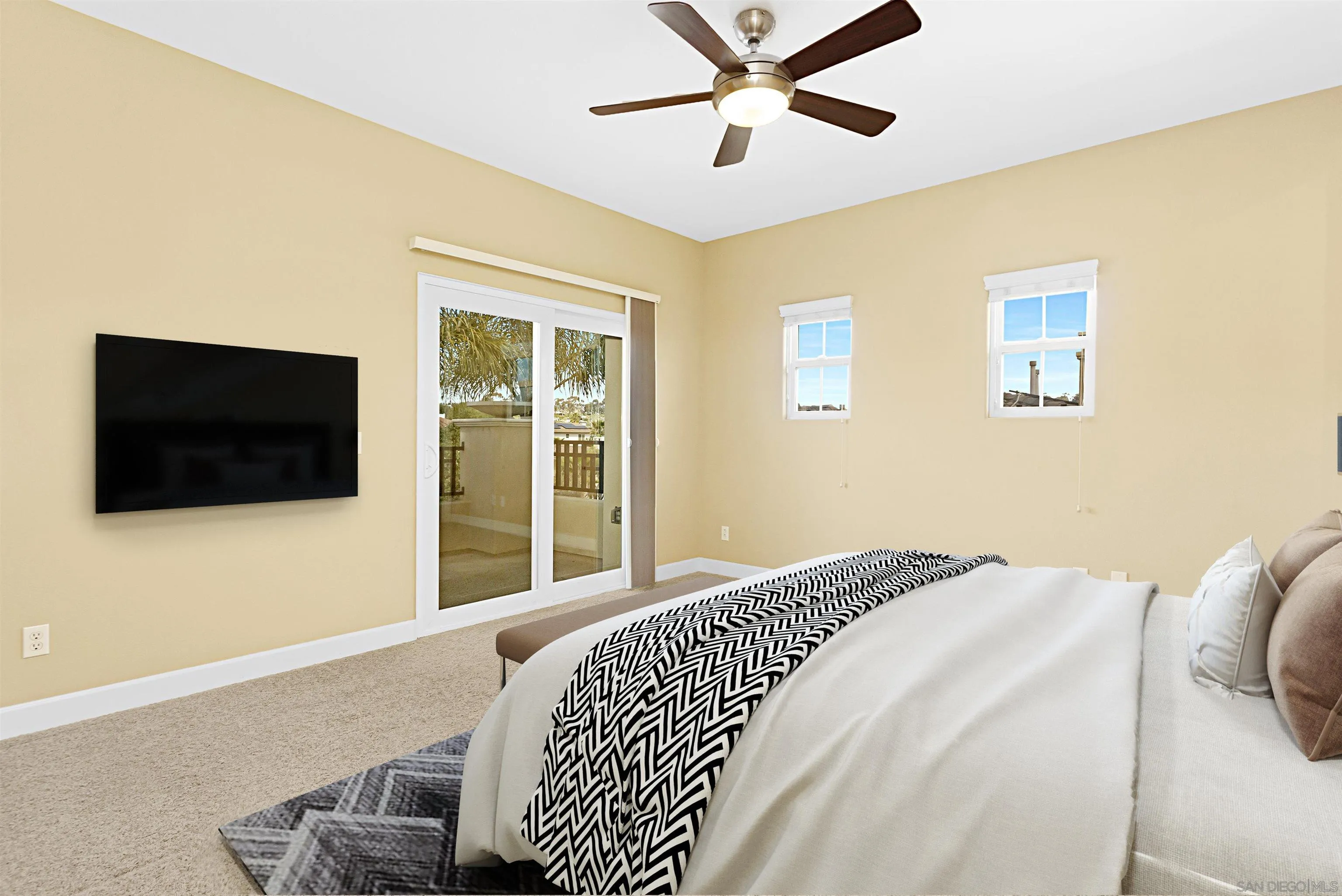 527 Quail Pointe Lane Encinitas, CA 92024 - Photo 33 of 46 a bedroom with a large bed and a flat screen tv