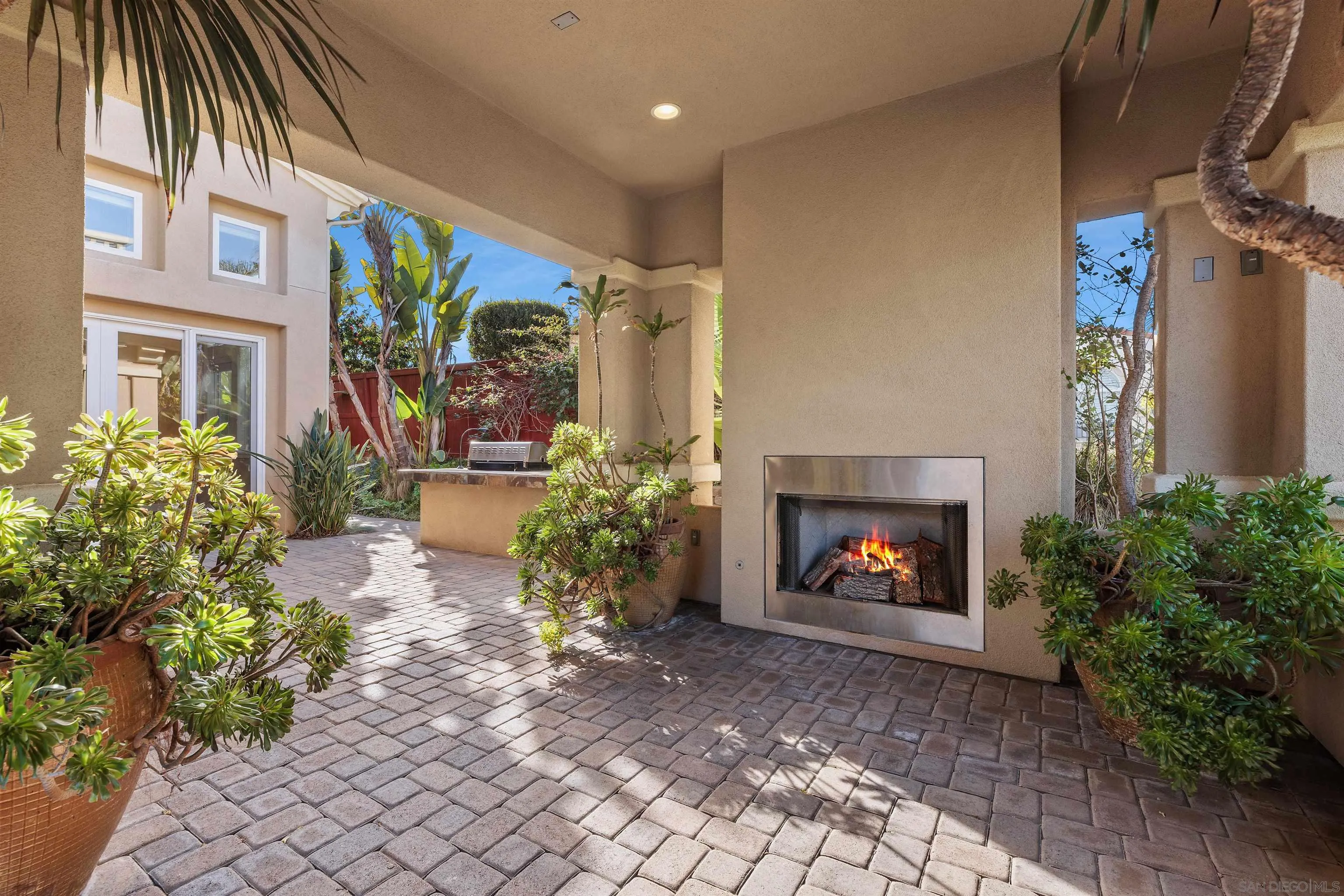 527 Quail Pointe Lane Encinitas, CA 92024 - Photo 9 of 46 a building with potted plants in front of it