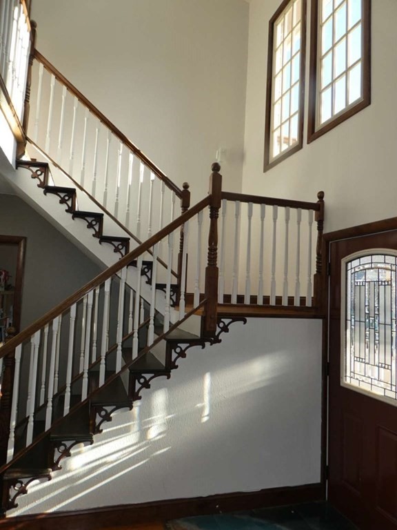 8 Garden Road Marblehead, MA 01945 - Photo 3 of 20 a view of a balcony with wooden floor and stairs