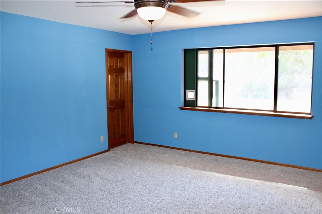 Primary bedroom with two walk-in closets