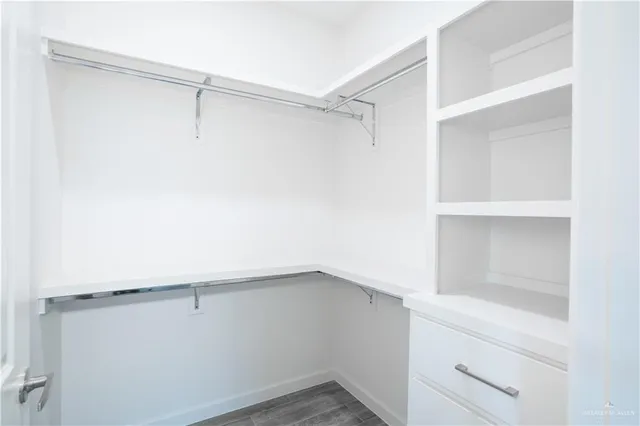 a view of an empty walk in closet