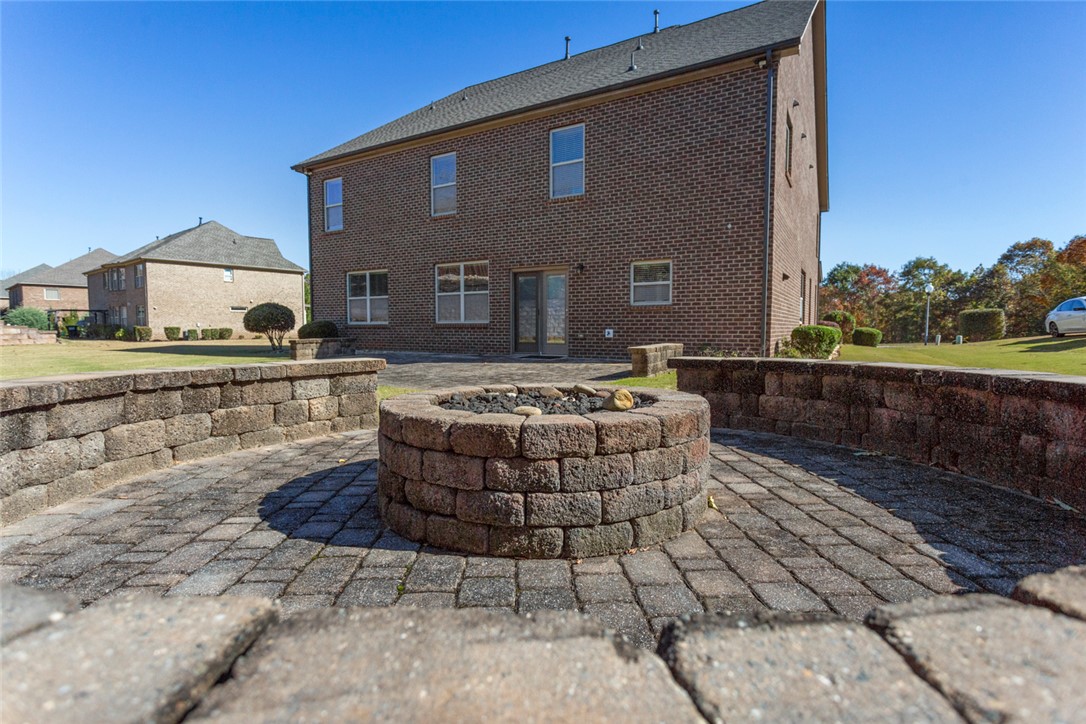 1005 Winmar Drive Anderson, SC 29621 - Photo 44 of 50 This spacious brick home features a cozy outdoor fire pit and a private patio area.