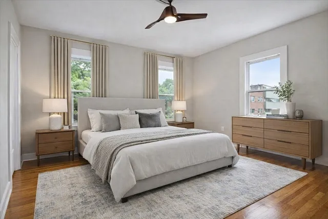 a bedroom with a bed and window