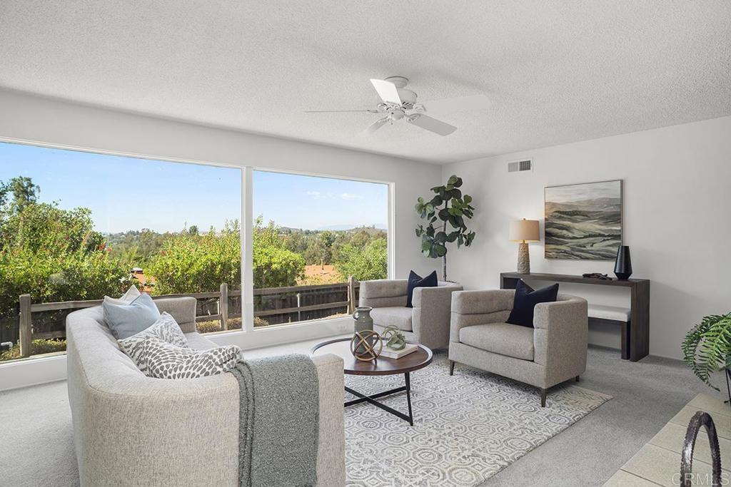 16342 Woodson View Road Poway, CA 92064 - Photo 1 of 1 a living room with furniture and a large window
