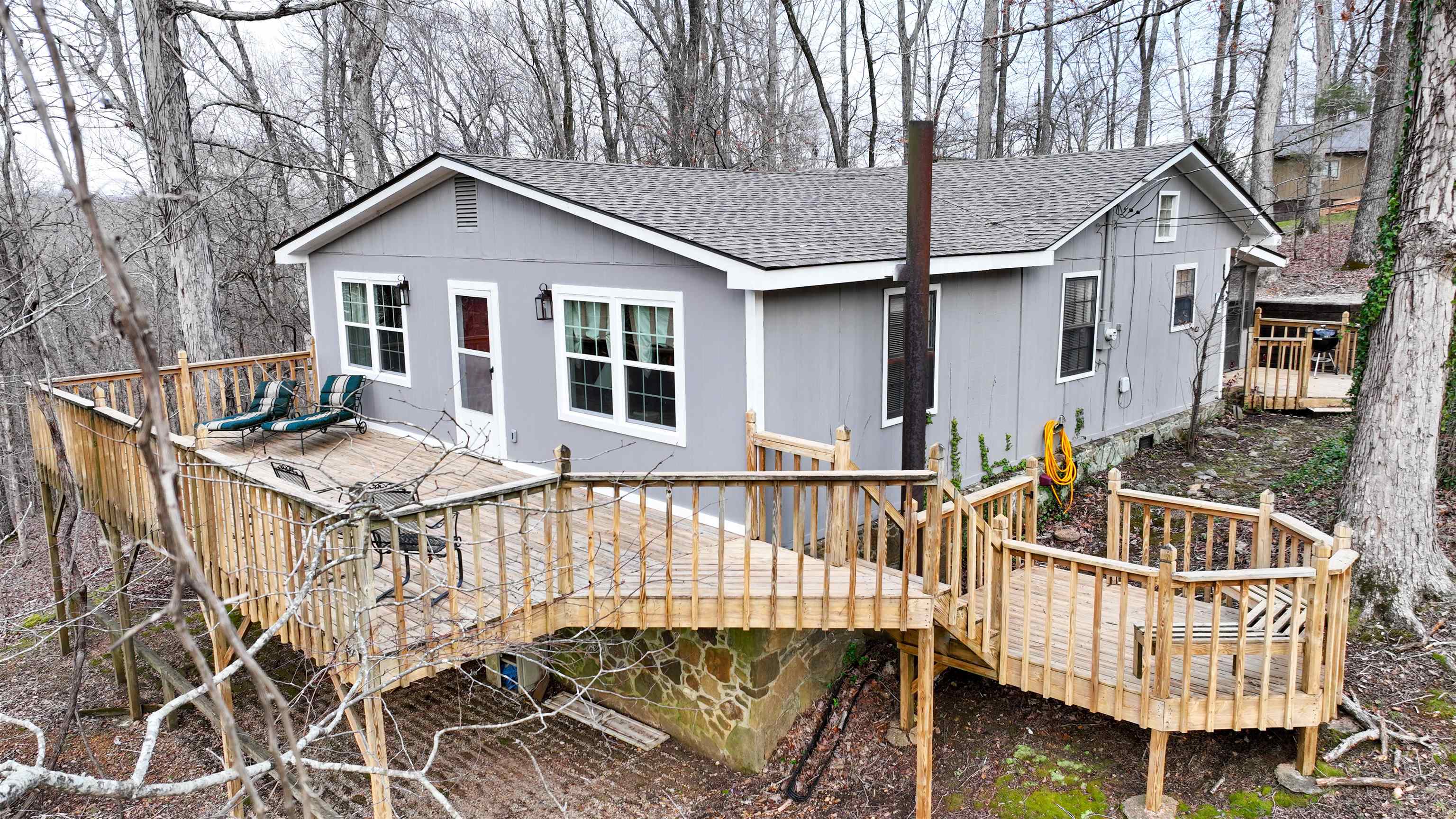 Back of property featuring a deck