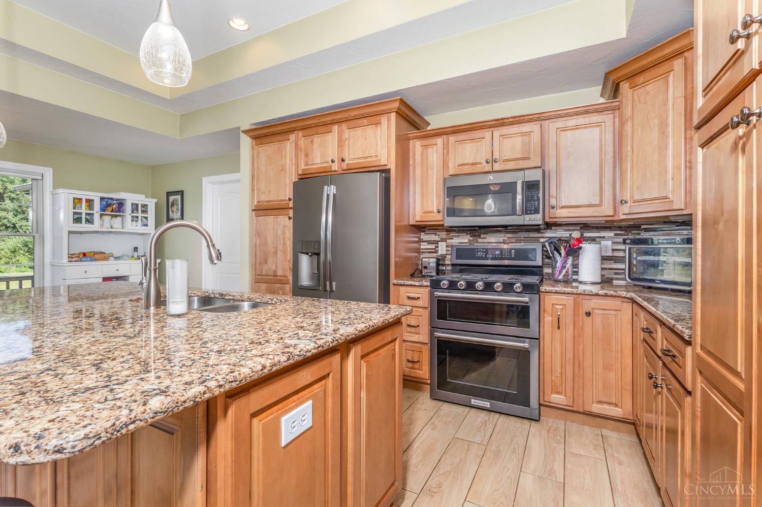 9454 North Dearborn Road Guilford, IN 47022 - Photo 5 of 42 maple raised panel cabinets, high end appliances and granite tops