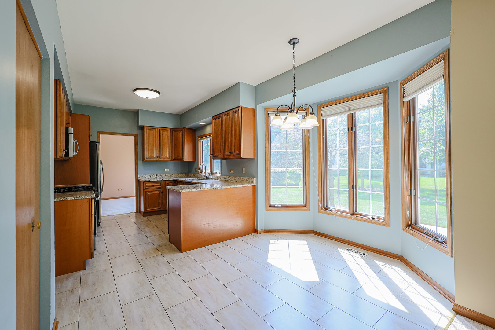 629 Dogleg Lane Bartlett, IL 60103 - Photo 15 of 37 a view of a kitchen with a refrigerator and a sink
