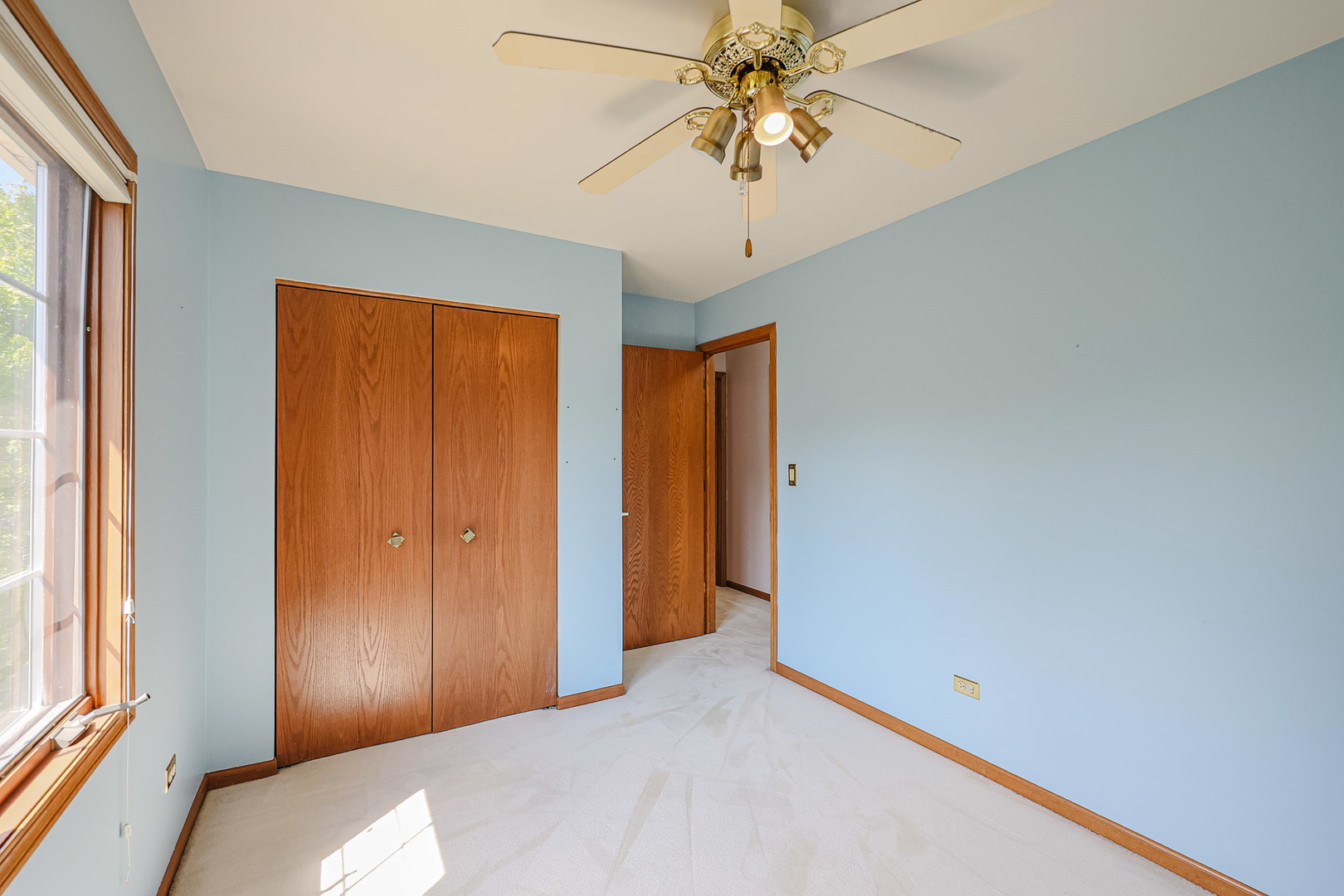 629 Dogleg Lane Bartlett, IL 60103 - Photo 23 of 37 a bedroom with a bed and a chandelier