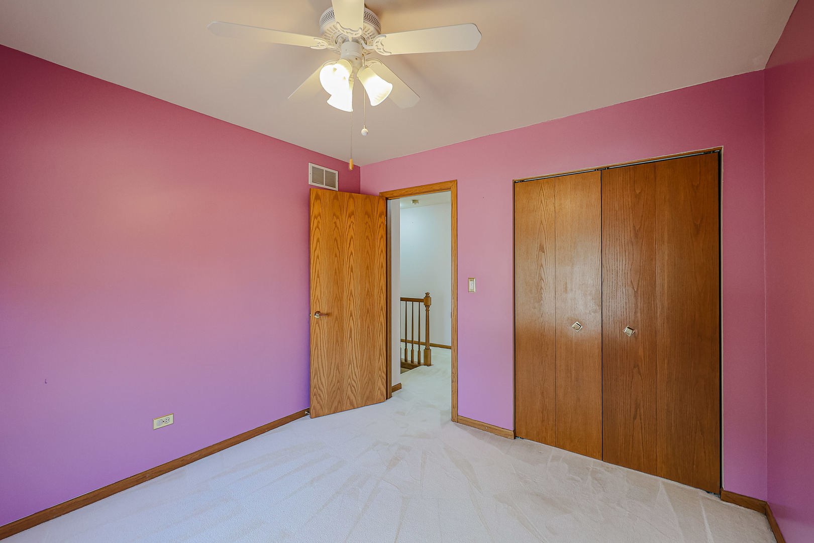 629 Dogleg Lane Bartlett, IL 60103 - Photo 29 of 37 an empty room with a chandelier fan and a glass door