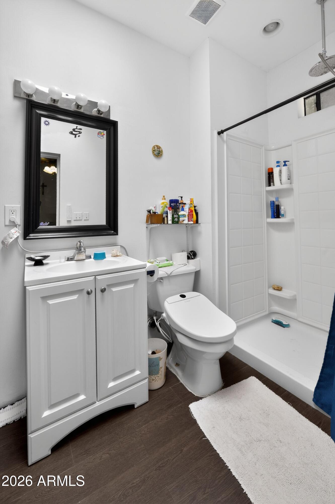 277 Círculo Silva Rio Rico, AZ 85648 - Photo 22 of 34 a bathroom with a toilet sink and mirror