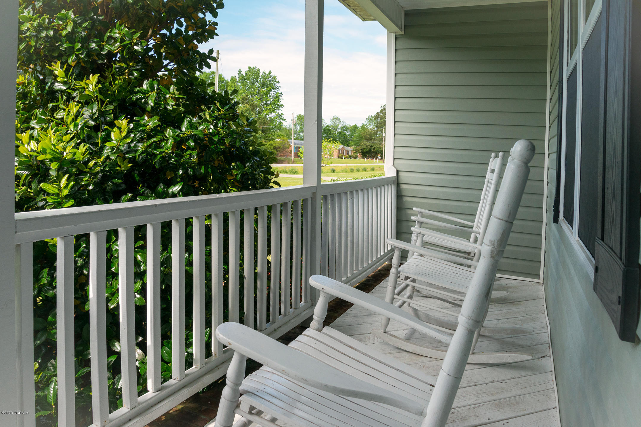 3225 Mobleys Bridge Road Grimesland, NC 27837 - Photo 3 of 30 Rocking chair front porch