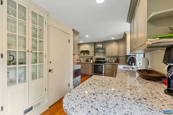 a kitchen with a refrigerator a sink and a stove