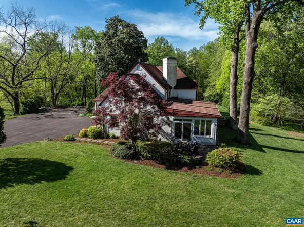 a backyard of a house with lots of green space