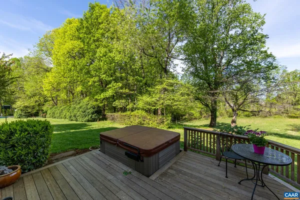 a view of a wooden deck with furniture