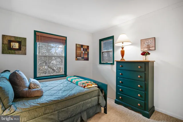 a bedroom with a bed and a couch