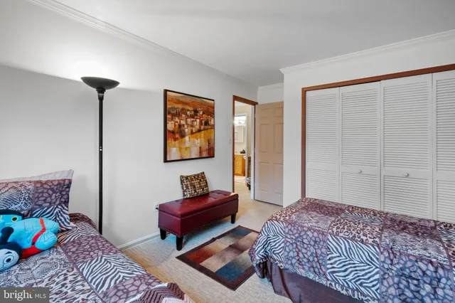 a bedroom with bed and a window