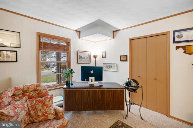 a room with furniture and a flat screen tv