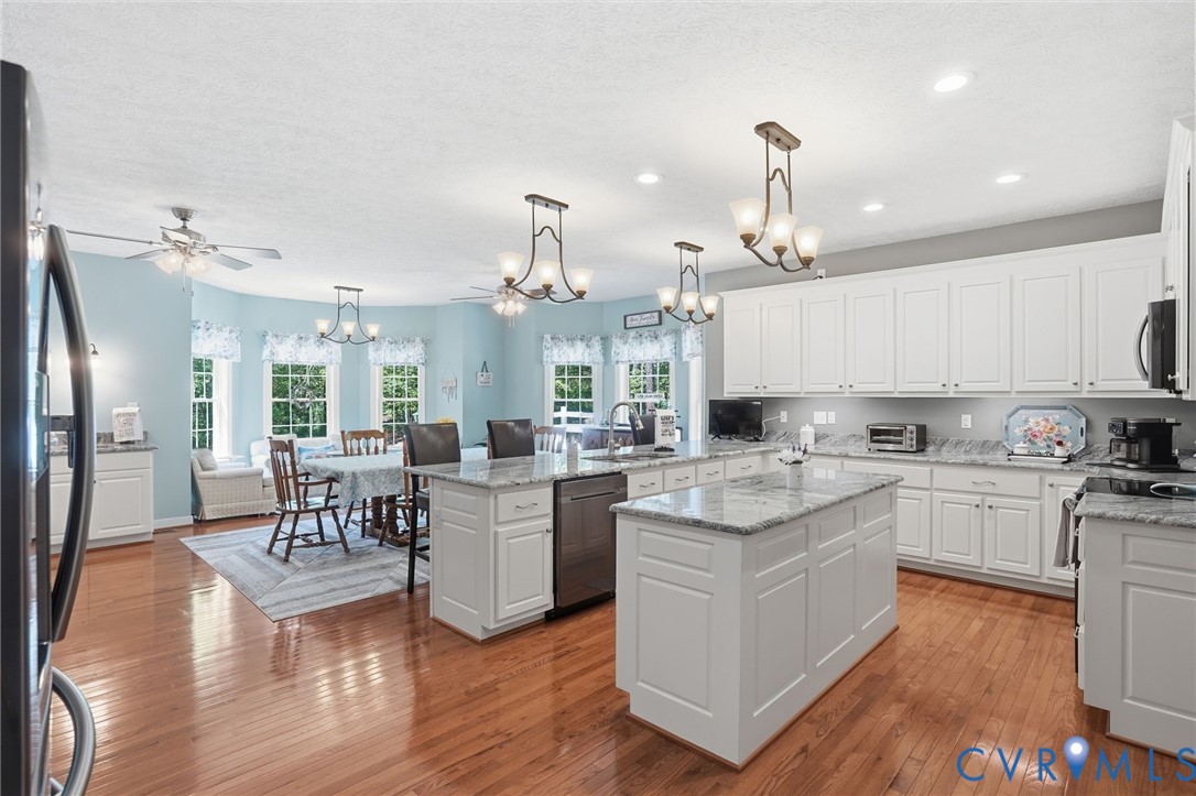 3600 Market Road Mechanicsville, VA 23111 - Photo 13 of 67 a large kitchen with cabinets chairs and wooden floor