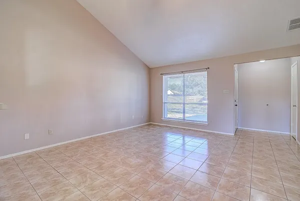a view of an empty room and window