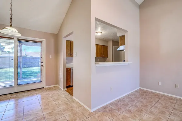 a view of an empty room with a bathroom