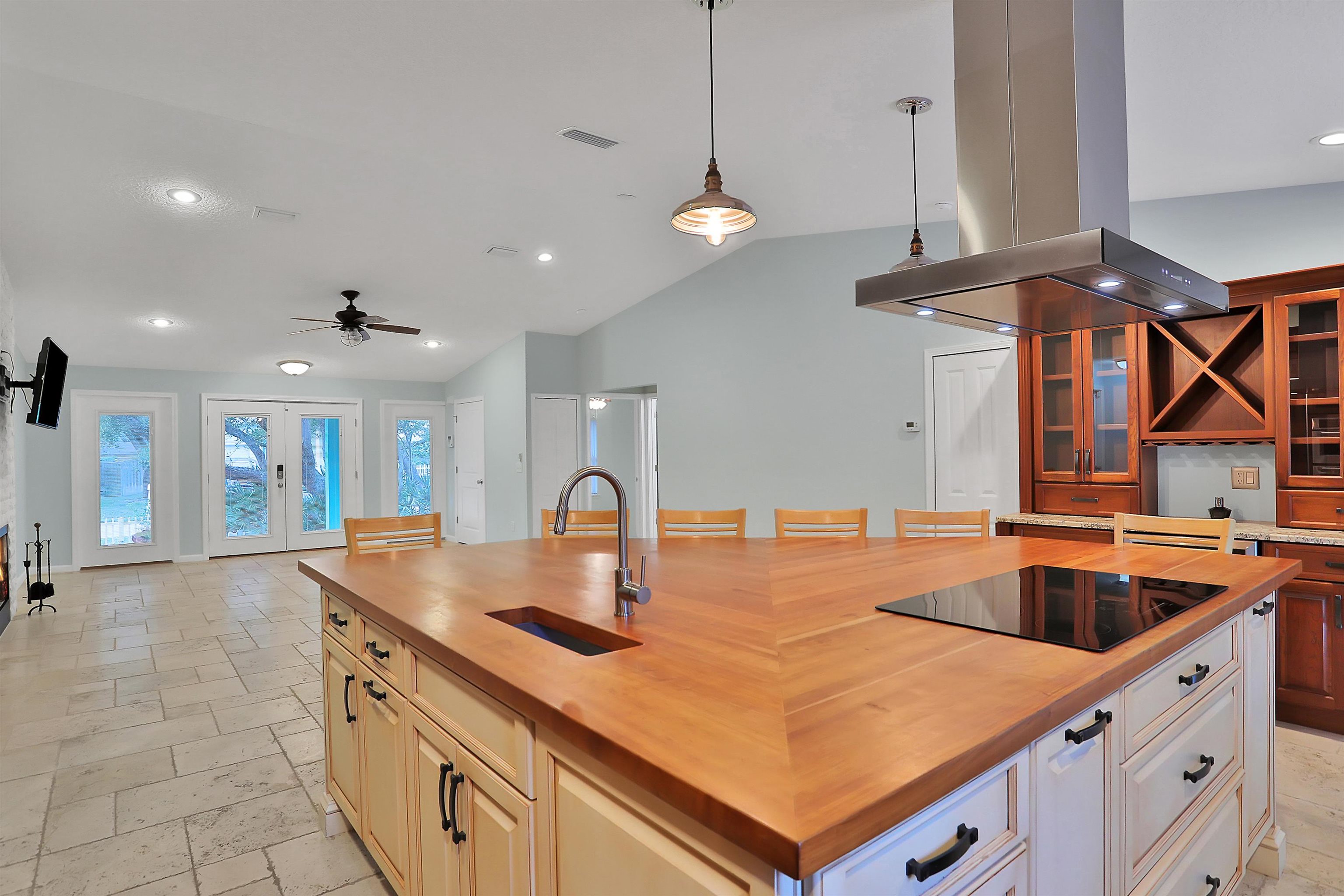 405 Boating Club Road St. Augustine, FL 32084 - Photo 14 of 35 a kitchen with stainless steel appliances a sink a counter space and a view of living room