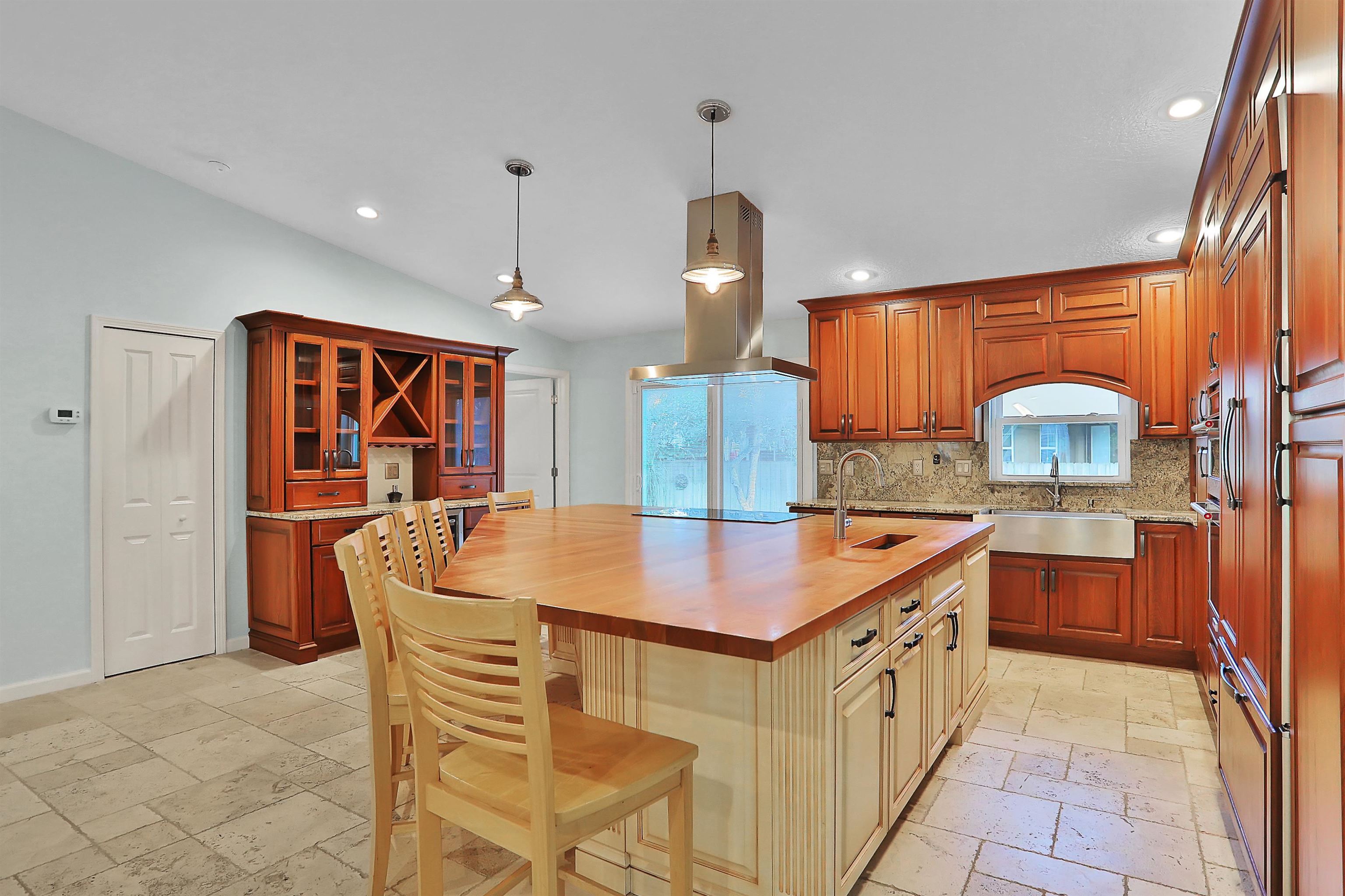 405 Boating Club Road St. Augustine, FL 32084 - Photo 17 of 35 a kitchen with stainless steel appliances granite countertop a sink and a refrigerator