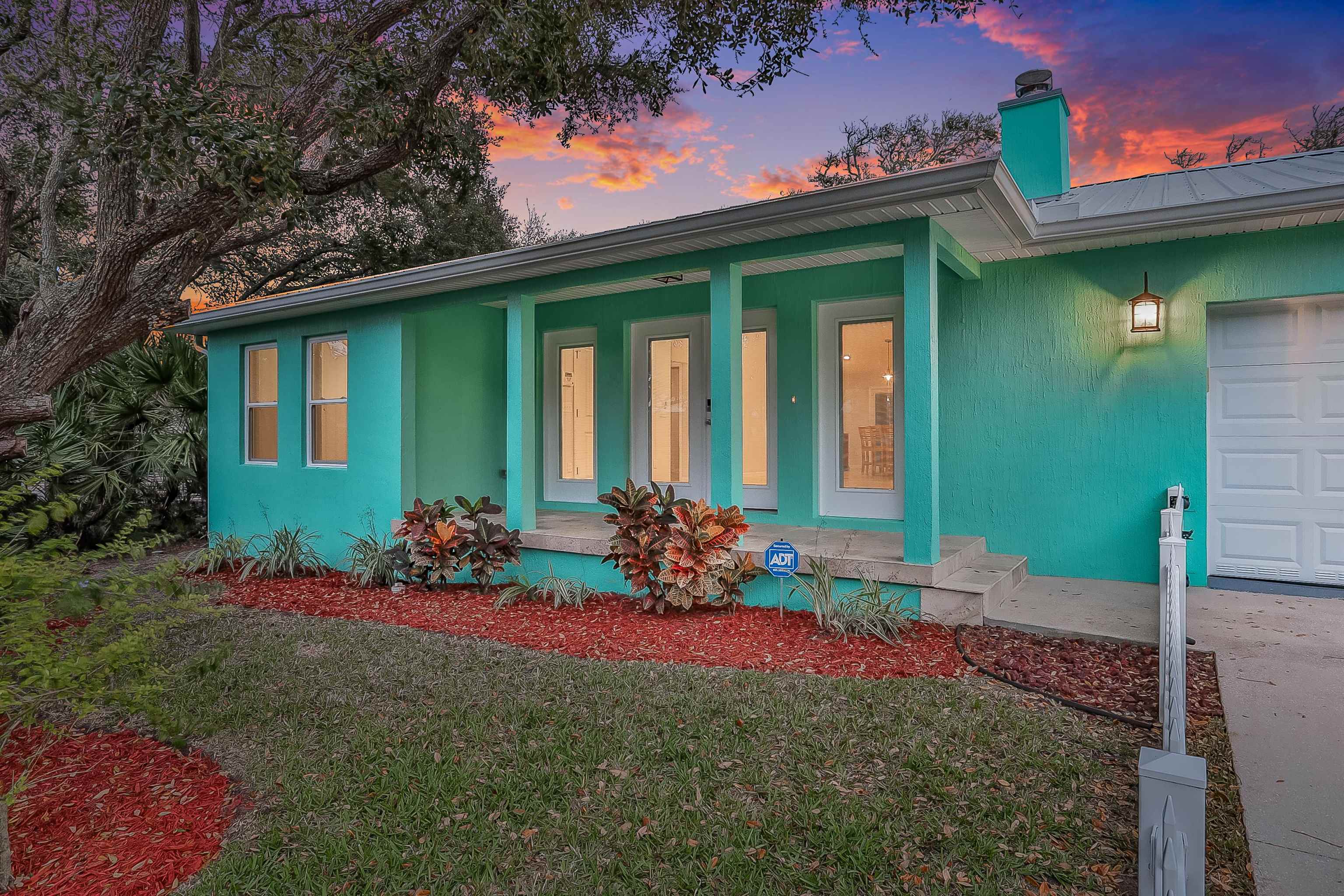 405 Boating Club Road St. Augustine, FL 32084 - Photo 2 of 35 a front view of a house with a yard