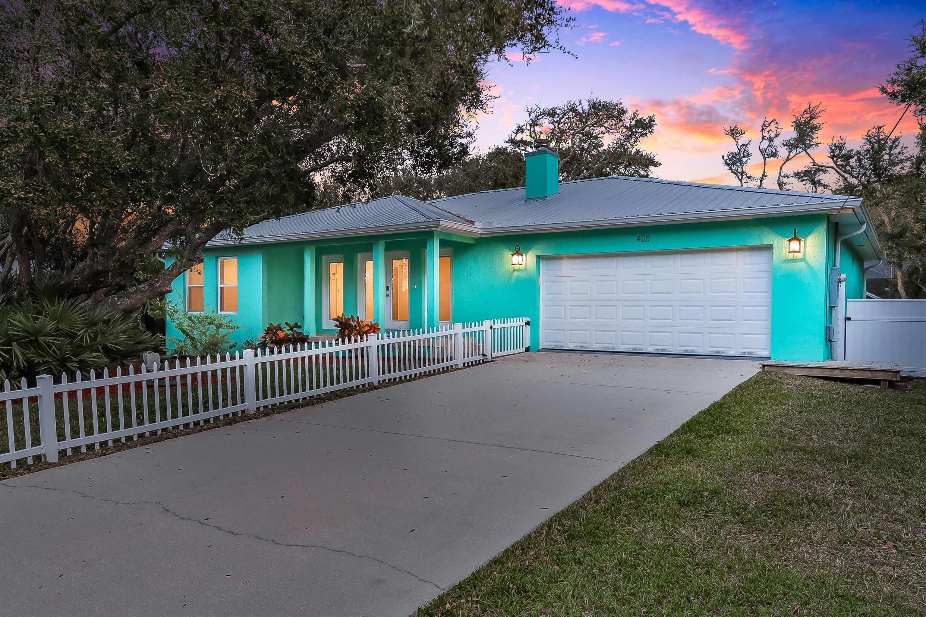 405 Boating Club Road St. Augustine, FL 32084 - Photo 3 of 35 a view of a house with a yard and garage