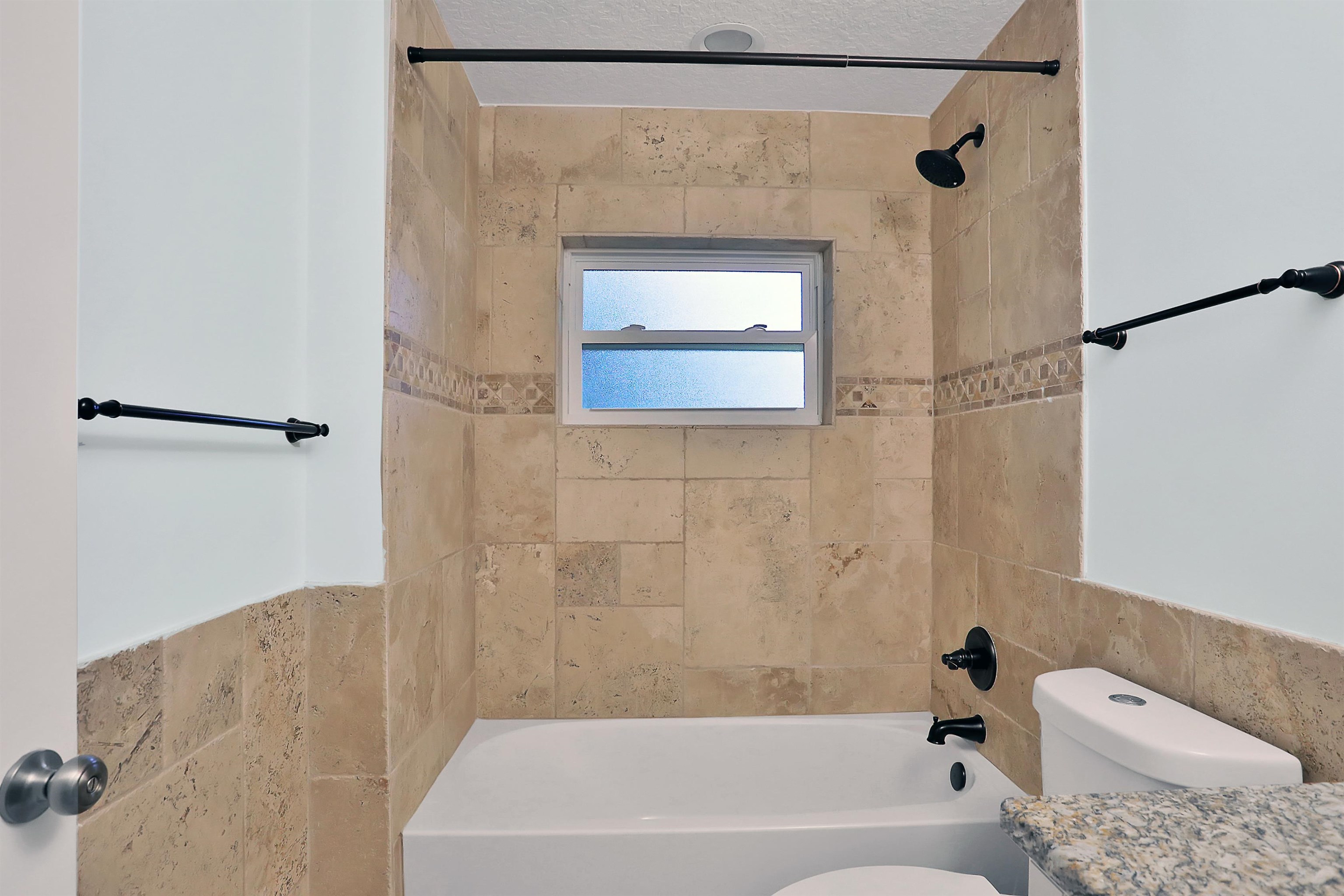 405 Boating Club Road St. Augustine, FL 32084 - Photo 31 of 35 a bathroom with a bathtub and a shower