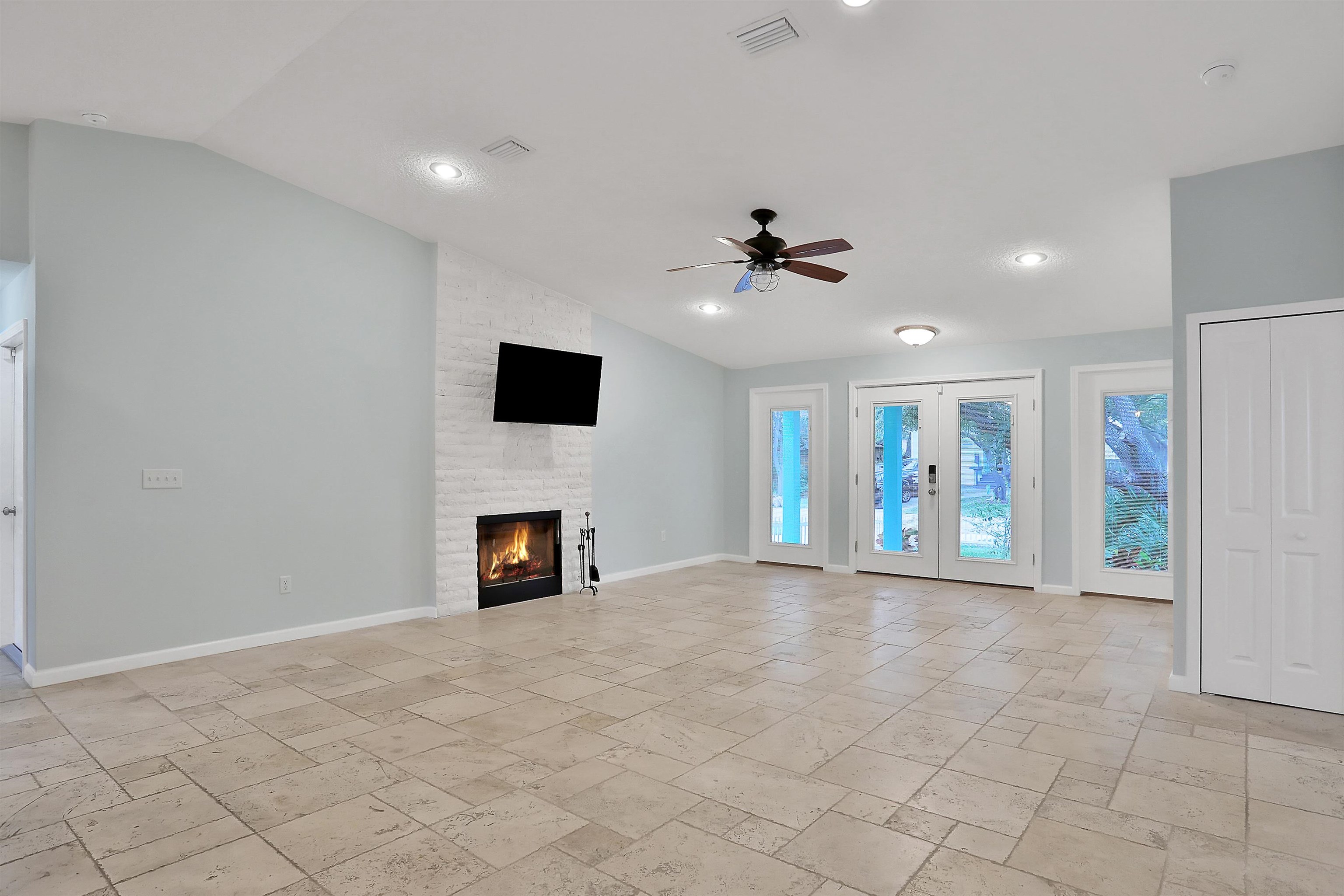 405 Boating Club Road St. Augustine, FL 32084 - Photo 8 of 35 a view of an empty room with a fireplace and a window