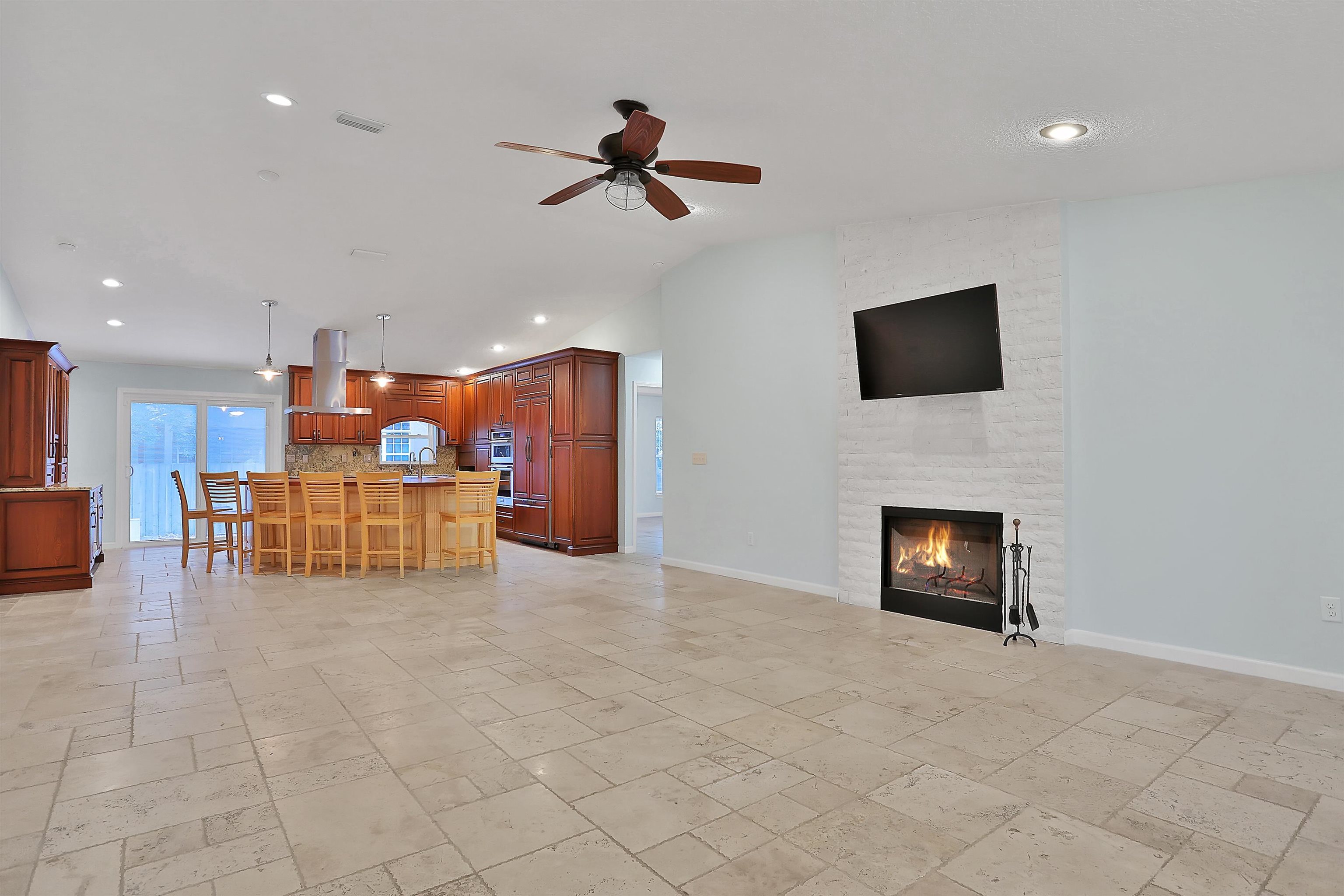 405 Boating Club Road St. Augustine, FL 32084 - Photo 10 of 35 a living room with furniture and a flat screen tv