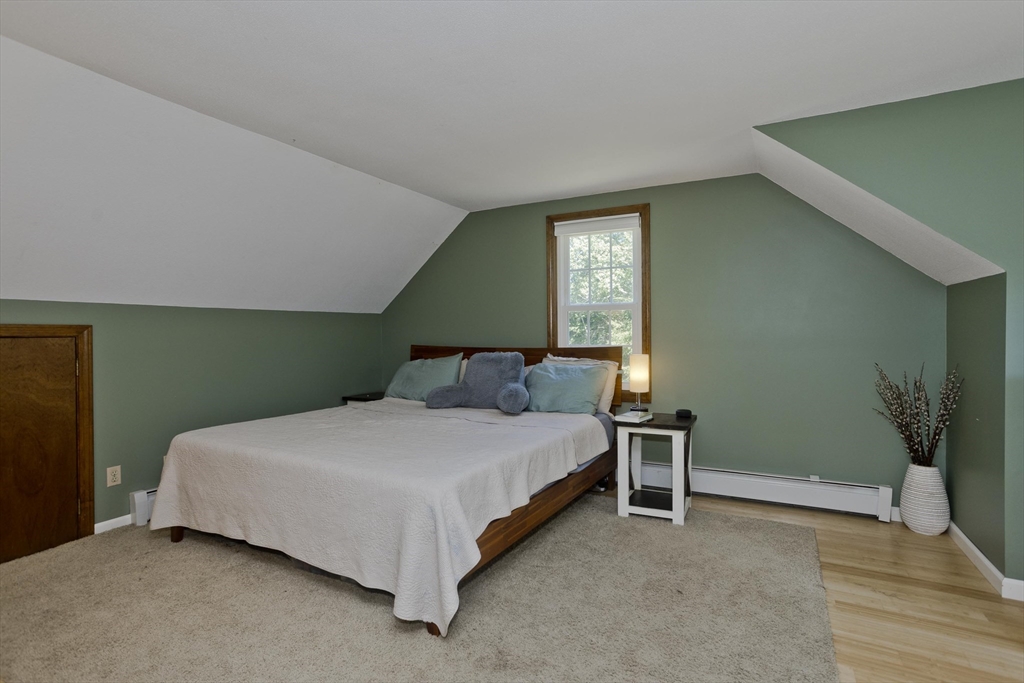 275 NW Road Westhampton, MA 01027 - Photo 18 of 42 a bedroom with a bed and a potted plant
