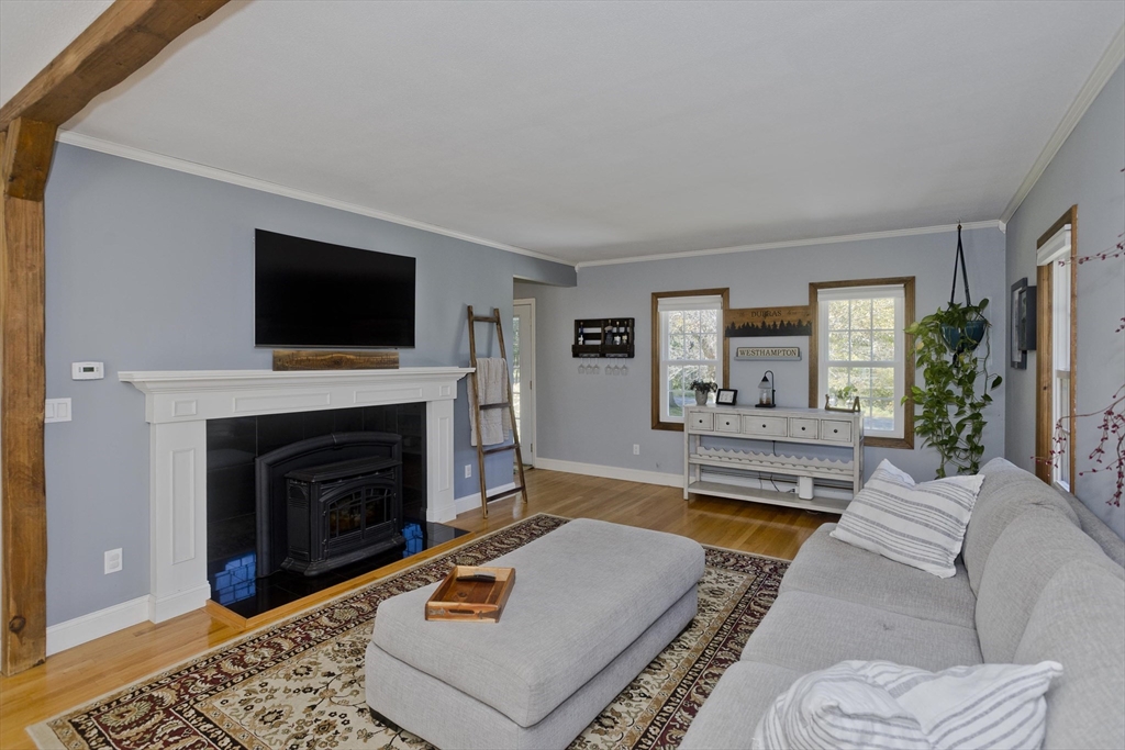 275 NW Road Westhampton, MA 01027 - Photo 10 of 42 a living room with furniture and a fireplace