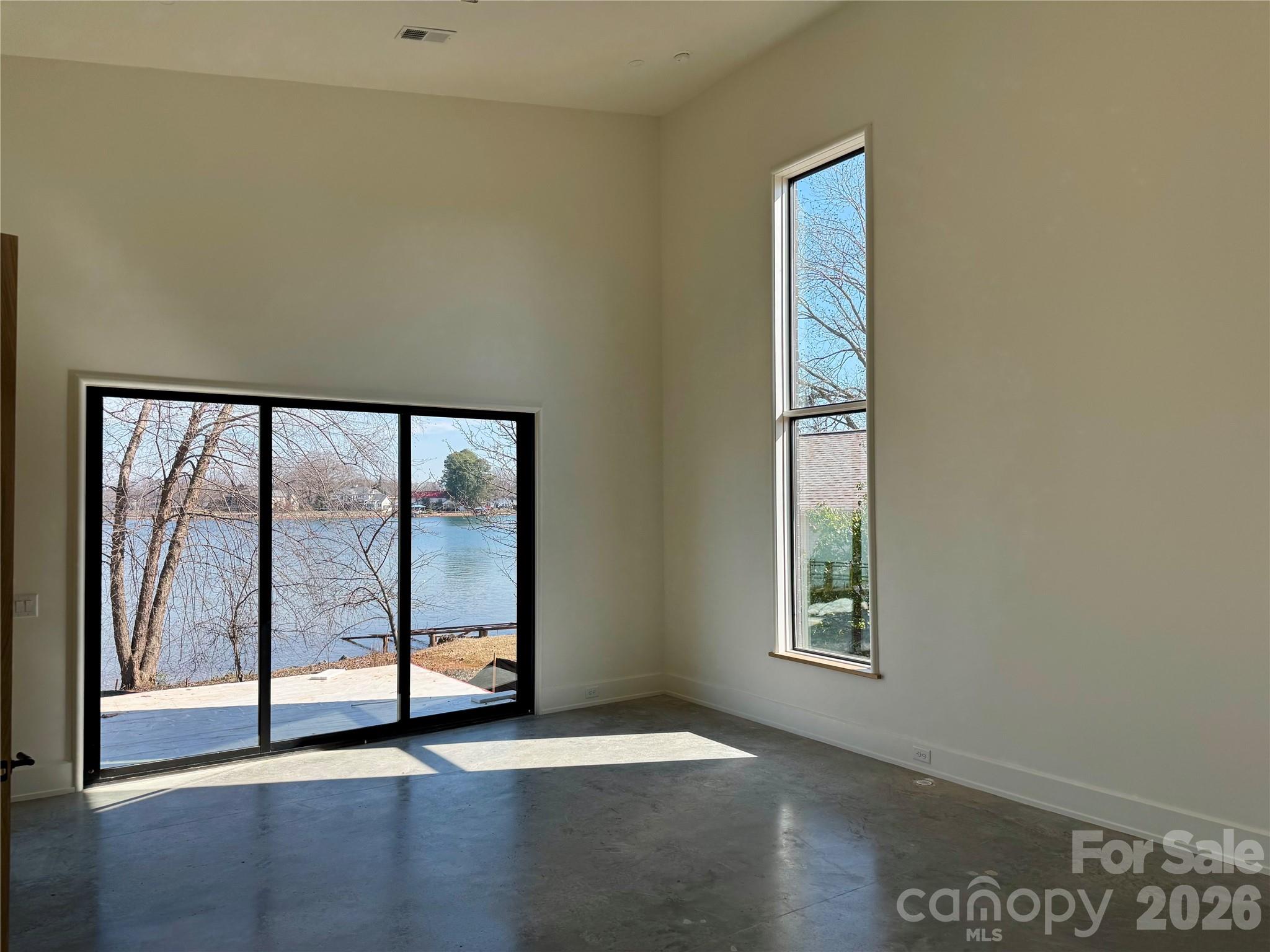 22554 John Gamble Road Cornelius, NC 28031 - Photo 29 of 45 an empty room with windows