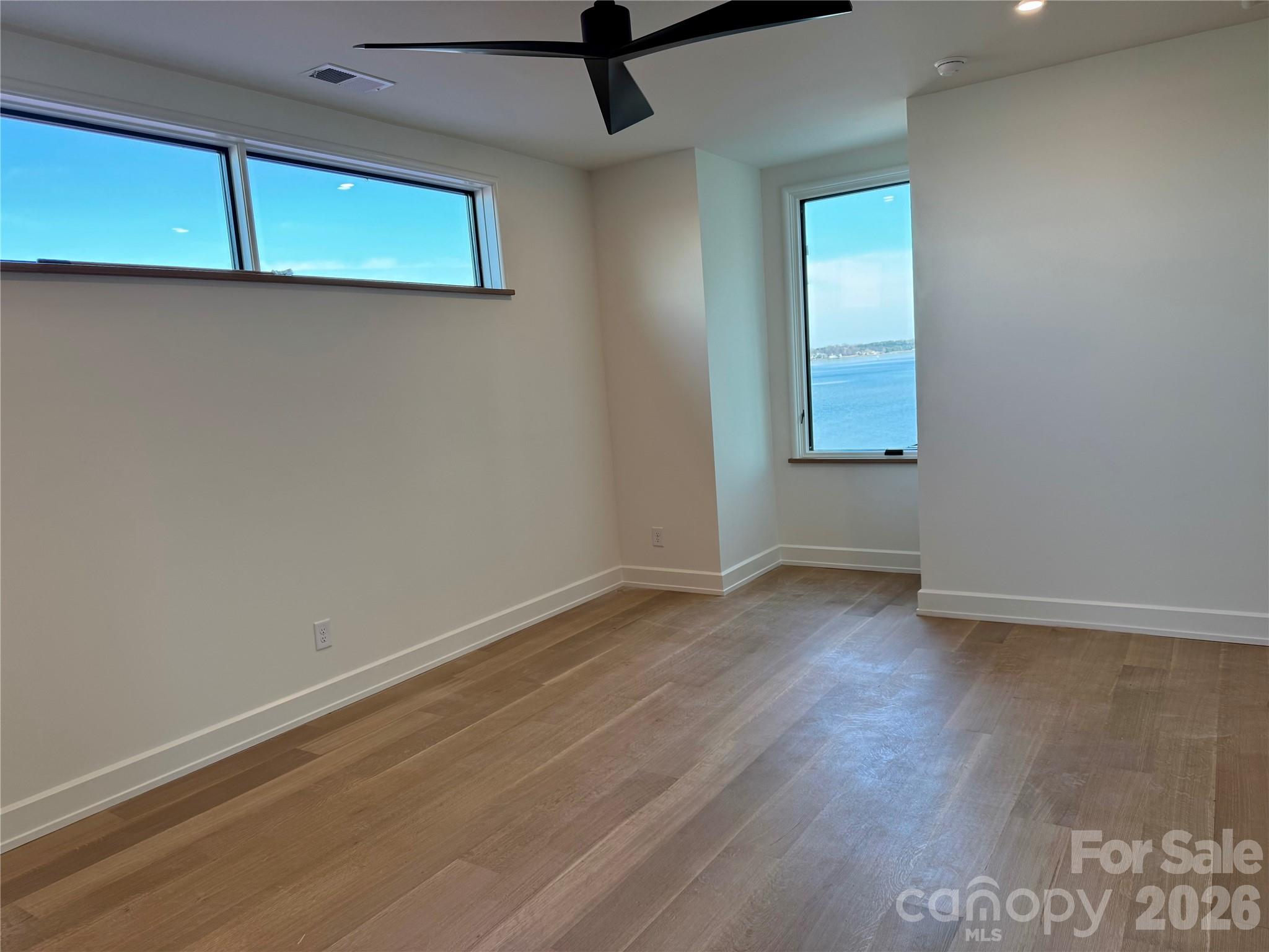 22554 John Gamble Road Cornelius, NC 28031 - Photo 34 of 45 a view of a room with wooden floor and a window